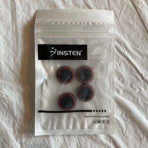 Four Black and Red Thumb Button Covers for Nintendo Switch/Lite